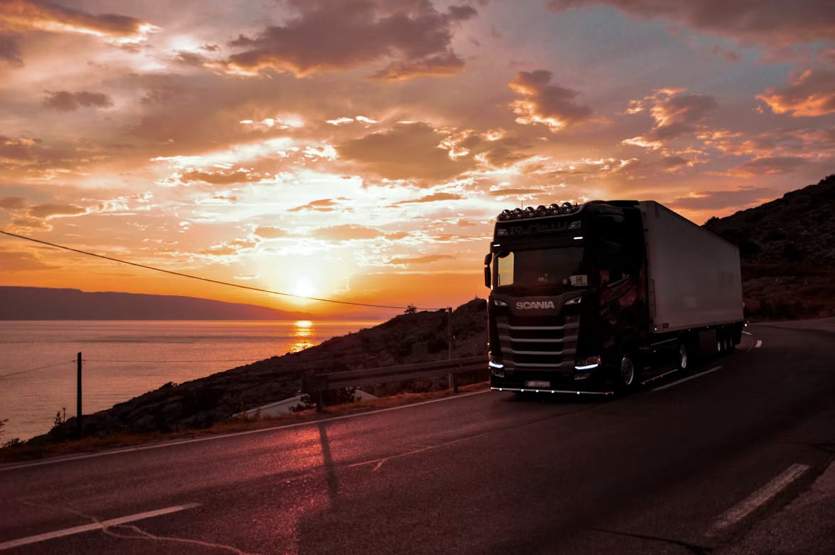 Freight truck on an East African road at sunset, representing IOR services across Rwanda and East Africa